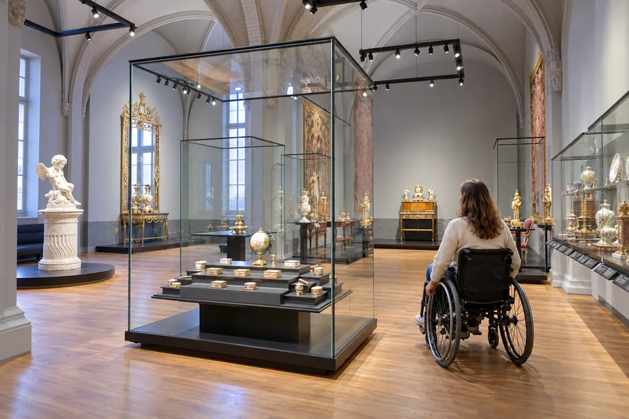 Wheelchair user exploring decorative arts at the Rijksmuseum